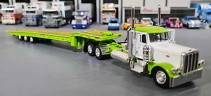 1/64 DCP PETERBILT 389 IN WHITE AND GREEN WITH TRI AXLE TILTING TRAILER 60-1447 - Picture 1 of 8