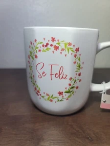"TAZA DE TÉ DE CAFÉ THALIA SODI MOTTOLA BLANCA SE FELIZ 4.5"" X 3.5" - Imagen 1 de 5