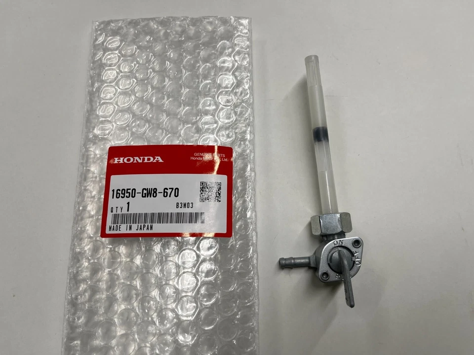 HONDA NOS 81-99 Z50R Z50 82 MB5 OEM GENUINO PETCOCK MONTAJE DE GALLO DE COMBUSTIBLE 16950-GW8-670 Foto 1 de 2