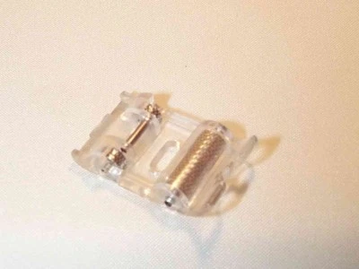 NEW ROLLER SEWING MACHINE FOOT (fits most snap-on machines) - Image 1 of 2