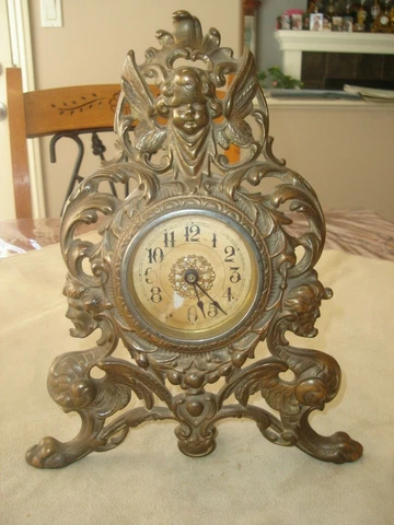 Antique Gilt Cast Iron Shelf Clock Gargoyle Base w/ Winged Cherub at Top, Runs Cover