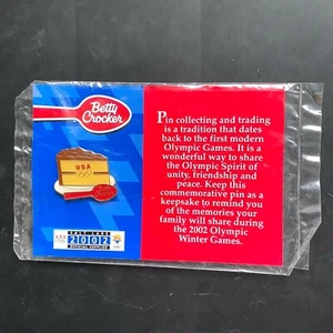 2002 SALT LAKE CITY OLYMPIC WINTER GAMES vintage hat pin BETTY CROCKER Cake UTAH - Picture 1 of 3