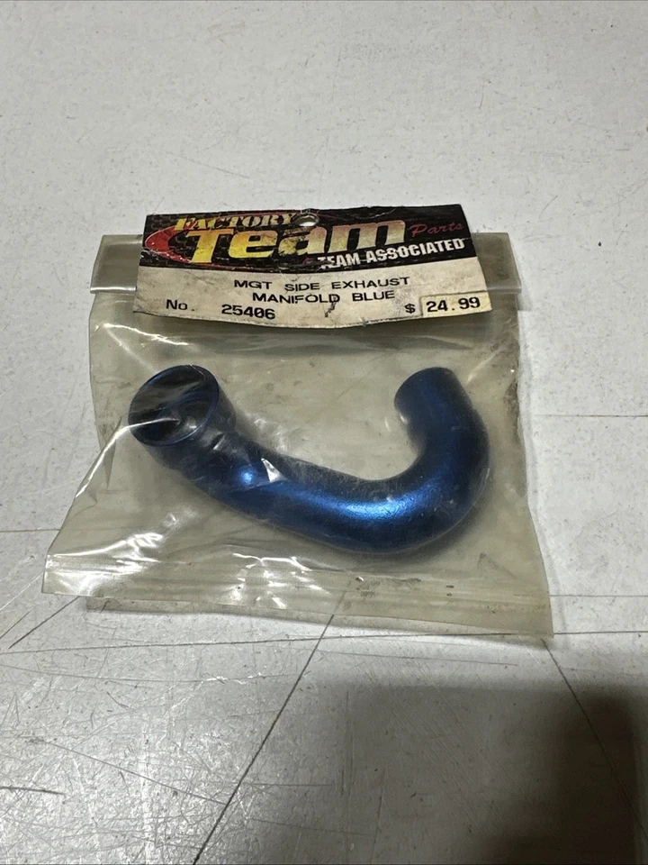 Team Associated Factory Team Exhaust Manifold NIP VINTAGE - Image 1 of 1