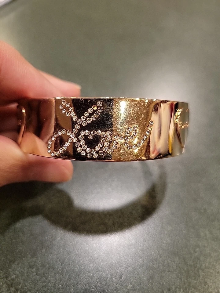 Bebe Gold Tone and Rhinestone Love Bangle - Image 1 of 4