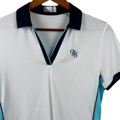 Camisa polo de golf elástica de manga corta para mujer Callaway Opti Dri mediana con logotipo de 9 y 8 Foto 1 de 4