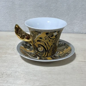Rosenthal Versace Medusa taza de té con alas de oro negro 2,5” y juego de platillos 4,25” - Imagen 1 de 6