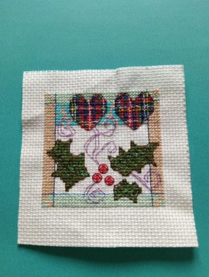 Completed Cross Stitch. Holly & Tartan Hearts. Ideal For Christmas Card Making. - Image 1 of 3