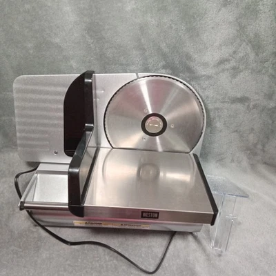 Cortadora eléctrica de carne de alimentos de 7,5" hoja de acero grosor ajustable delicatessen usada Foto 1 de 4