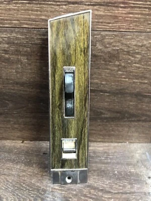 Cadillac Seville: 1976, 1977, 1978, 1979, bisel eléctrico de bloqueo de puerta con grano de madera Foto 1 de 4