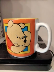 Taza de café de colección Disney Winnie the Pooh, Sides of Pooh naranja amarillo 14 oz. - Imagen 1 de 4