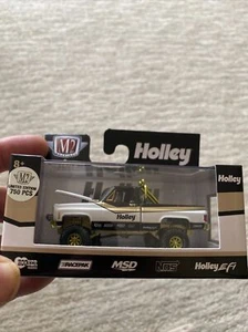 MÁQUINAS M2 1976 GMC SIERRA GRANDE 15 4x4 Chase Borde Oro 1/750 1:64 R64 Nuevo - Imagen 1 de 11