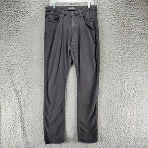 Pantalones de mezclilla DU/ER para hombre 33x34 negros elásticos tiro medio N2X relajados cónicos *EXCELENTE ESTADO* - Imagen 1 de 15