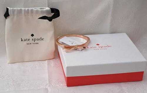 Bracciale Kate Spade grande fiocco oro rosa note d'amore etichetta sacchetto e scatola NUOVO
