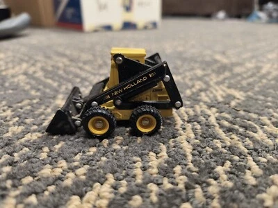 Vintage Loose Ertl New Holland Skid Steer Loader L555 Diecast 1:64 Scale Toy - Image 1 of 4