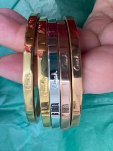 SOLD. SOLD 5 NWOT COACH  Signature Bracelets Bangles Yellow, Pink, Silver Colors - Picture 1 of 7