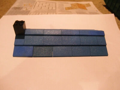 lego 10x20 azul vintage tejas anchas bajo perfil lage techo con chimenea negra Foto 1 de 4