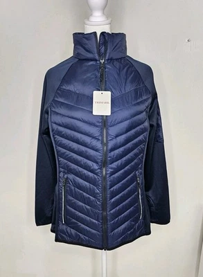 Chaqueta acolchada azul Trimark para mujer mangas de polietileno bordado mediano lotería Michigan  Foto 1 de 4