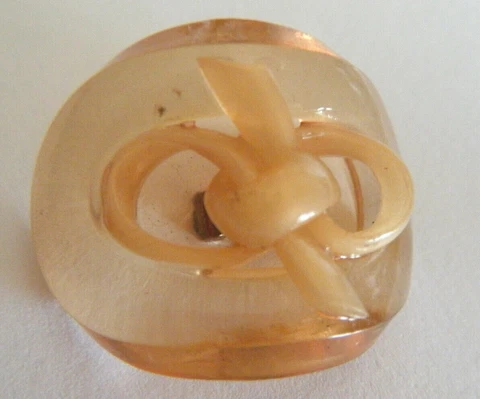 Antique oval button celluloid apple juice color attractive bow design 1" Cover