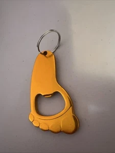 Llavero abrebotellas Corona Light forma pie metal naranja - Imagen 1 de 2