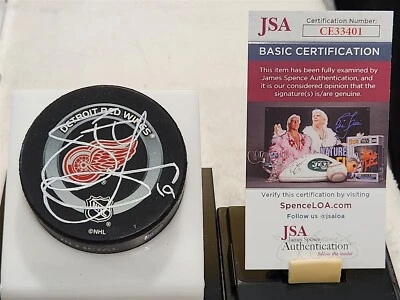 STEVE YZERMAN signed RED WINGS official game puck JSA COA - Image 1 of 2