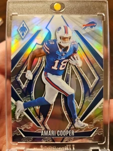 Logotipos del equipo Panini Phoenix Amari Cooper #7 2024/299 Buffalo Bills  - Imagen 1 de 2
