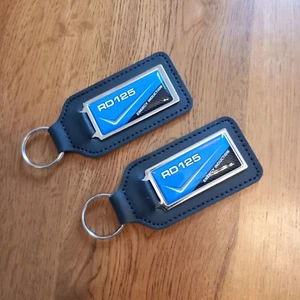 Pack 2 Yamaha RD125LC - 10W/12A Blue Leather Keyrings for RD 125 LC - NOS Parts - Picture 1 of 2