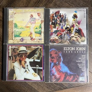 LOT OF 4 ELTON JOHN CDs- Your Songs / Hits / Reg Strikes Back / Goodbye Yellow - Picture 1 of 4