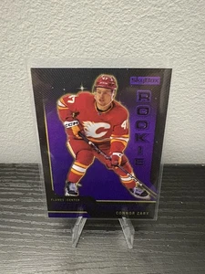2023-24 Skybox Metal Universe Connor Zary Purple /199 - Picture 1 of 2