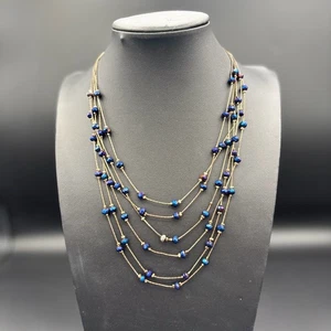 Collar de varias capas con cuentas de vidrio azul iridiscente hilo de seda dorado de varias hebras - Imagen 1 de 4