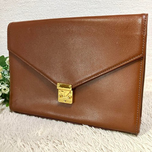 SAINT LAURENT (YSL) Borsa pochette uomo Yves Saint Laurent pelle cammello fodera logo oro ferramenta chiave