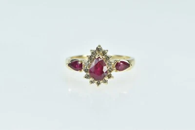 Anillo de compromiso de oro amarillo con halo de diamantes y rubí pera de 14K *15 Foto 1 de 4