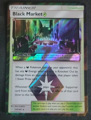 Black Market 134/181 Pokemon TCG Sun & Moon: Team Up Prism Star VLP - Image 1 of 2