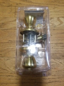 Kwikset Tylo pomello porta letto e bagno in ottone antico - scatola aperta - Foto 1 di 1