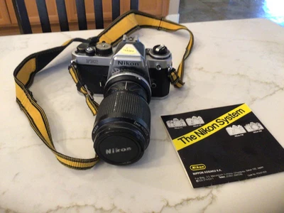 Cámara Nikon FE2 con Nikon - Nikon AF Nikkor 24 mm 1:2,8 gran angular sin probar Foto 1 de 4