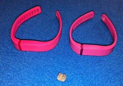 Muñequeras de goma Fitbit Flex rosa y magenta con un clip Foto 1 de 4