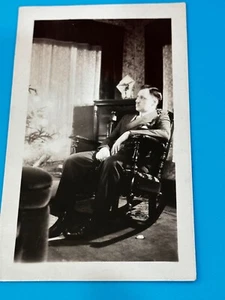 VTG. 1931 Photograph of man sitting in rocking chair looking at Christmas tree - Picture 1 of 6
