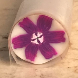 Purple flower in flower polymer clay cane - Picture 1 of 2