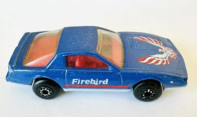 "Coche fundido a presión vintage Matchbox Pontiac Firebird SE - púrpura 1982 1:64 longitud 3""" Foto 1 de 4