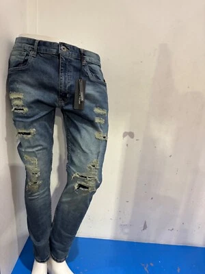 Pantalones de mezclilla ajustados Thread Theory tinte azul rasgado y reparación Foto 1 de 4