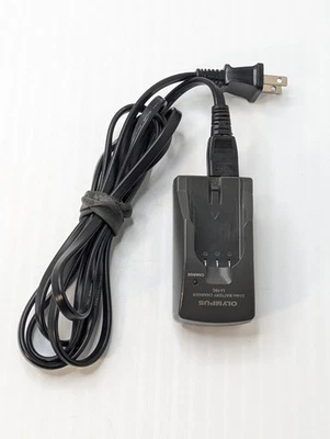 Base de cargador de batería de iones de litio original Olympus LI-10C para baterías LI-10B LI-12B Foto 1 de 4