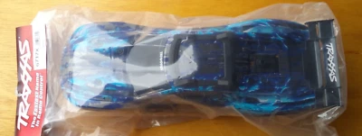 New Genuine Traxxas 6717 X Rustler® 4wd VXL® Body Special Edition Blue / Silver - Image 1 of 2