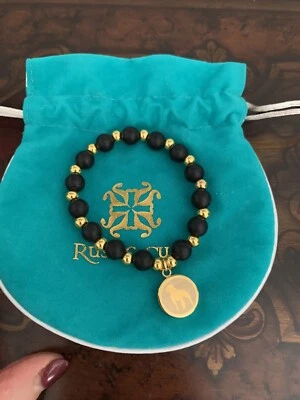 Brazalete rústico negro y dorado con cuentas de silicona y metal para perro Foto 1 de 4