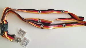 2X DEUTSCHLAND FUßBALL FANARTIKEL UMHÄNGEBAND/SCHLÜSSELBAND MIT CLIP GERMANY2006 - Bild 1 von 1