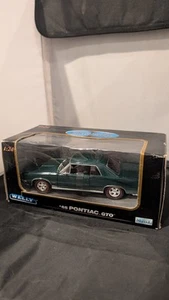 1965 PONTIAC GTO 1/24 SCALE GREEN DIECAST CAR BY WELLY 2092 - Picture 1 of 8