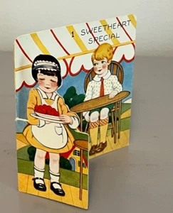 Tarjeta de San Valentín troquelada de pie chica bonita camarera sirviendo corazones 1920 - Imagen 1 de 5