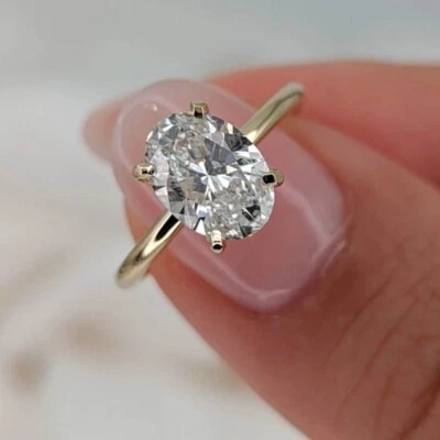 Anillo de compromiso de oro amarillo de 18 quilates 1,50 quilates diamante talla ovalada IGI cultivado en laboratorio Foto 1 de 4