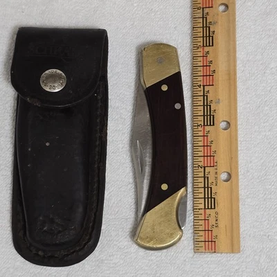 Cuchillo de caza plegable con funda de cuero Schrade USA vintage tío Henry LB7 Foto 1 de 4