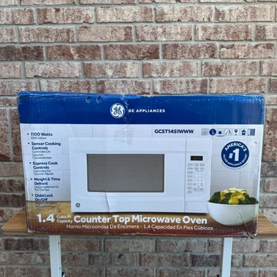 Microondas de encimera GE blanco 1,4 pies cúbicos 1100 W GCST14S1WWW caja abierta abolladura lateral Foto 1 de 4