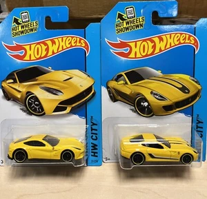 HOT WHEELS 1:64 SET OF 2 CARS. FERRARI F12 BERLINETTA & FERRARI 599 GTB YELLOW - Picture 1 of 1