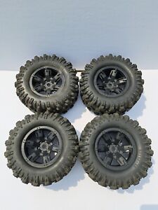 Traxxas Xmaxx 8s Used Tires and Rims Wheels Black 7772X used 1 torn read look